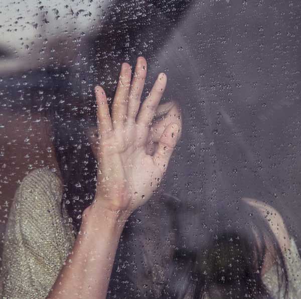 women-touch-rainy-glass-secret-thoughts